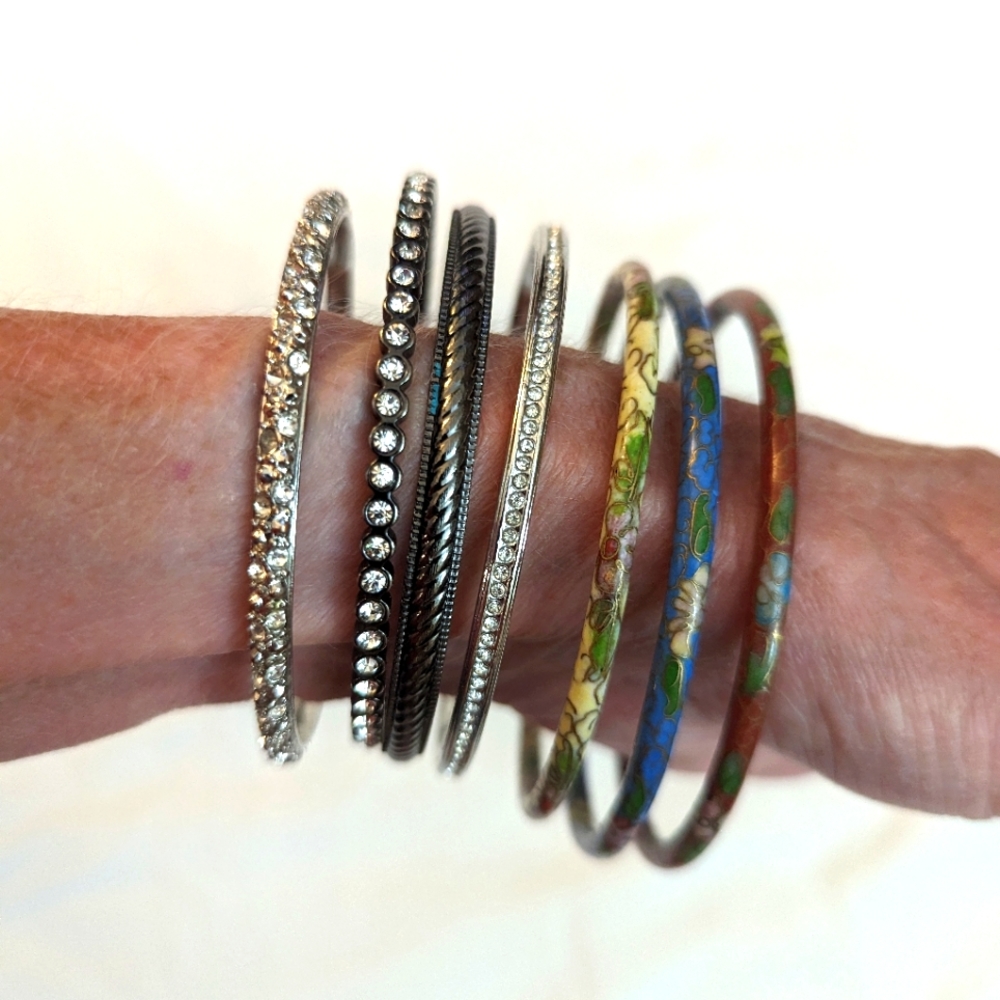 7 Bracelets. 3 Cloissone and 4 silver or black.